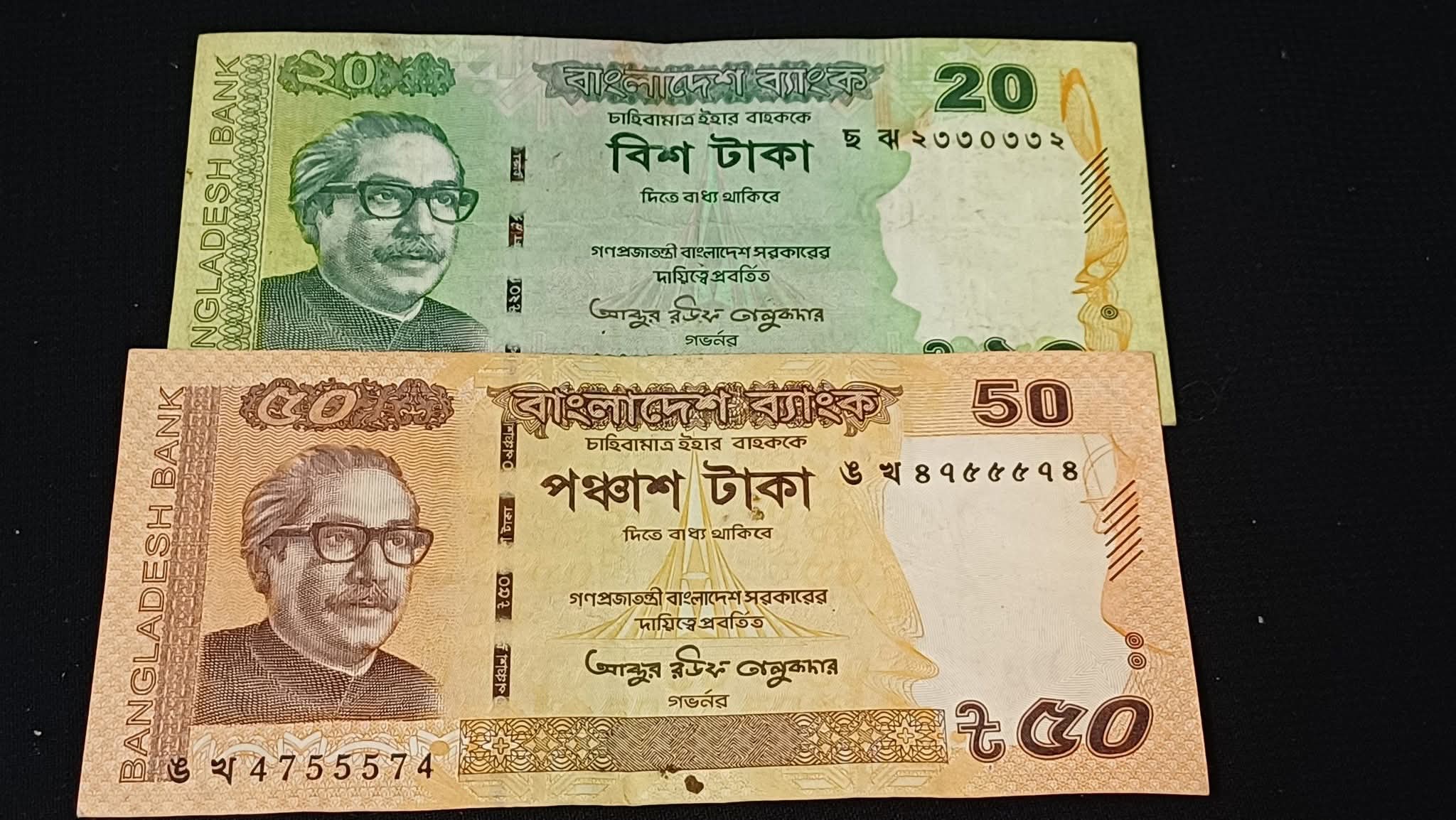 Two pieces of repeater notes of 20 and 50 taka
